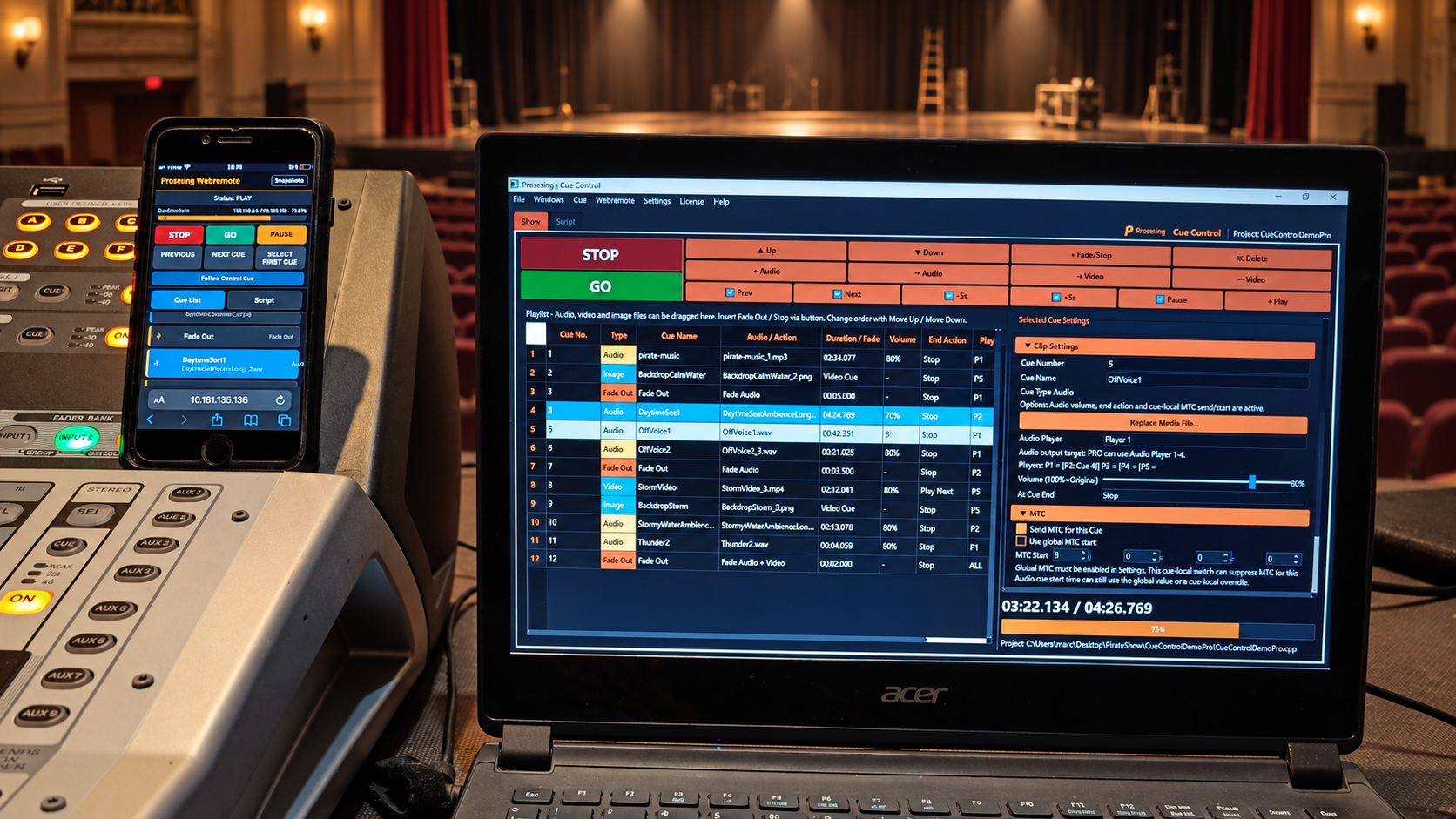 Proseniq Cue Control running on a laptop beside a smartphone showing Proseniq Webremote in a real live-production control setup