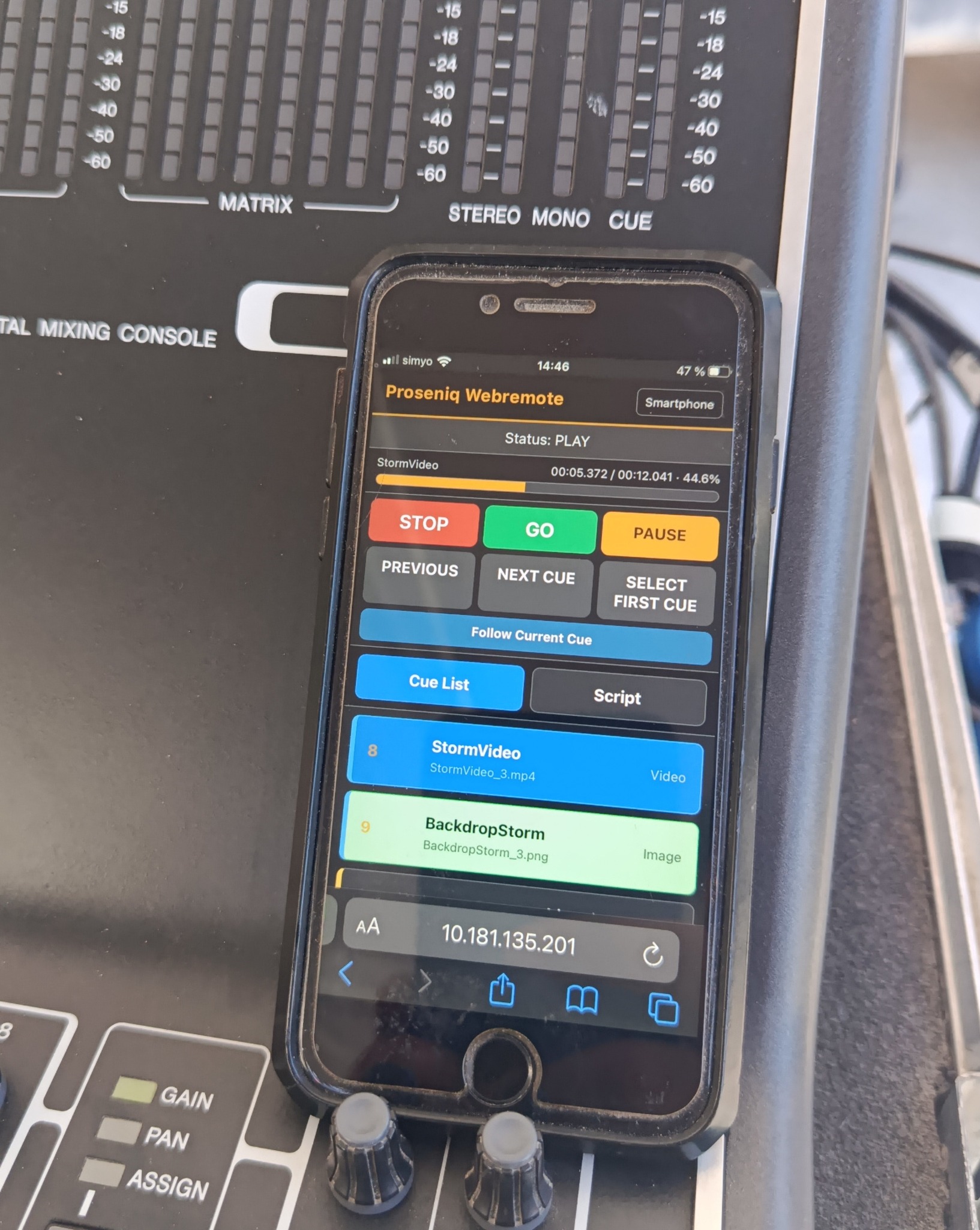 Proseniq Webremote open on a smartphone placed on a digital mixing console during a production
